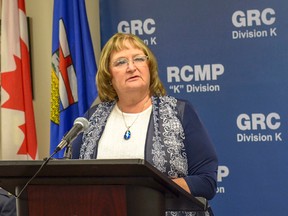 President Rosemary Lindsay of the Cochrane Foothills Protective Association and Rural Crime Watch speaks to a crowd before a behind-the-scenes tour of the Southern Alberta Crime Reduction Unit on May 24. The unit has brought crime statistics down significantly since its inception in February.