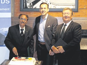 Paul Kalra (left) is recognized with an award during National Tourism Week for his tourism advocacy by MP for Banff-Airdrie Blake Richards (middle) and former Banff mayor John Stutz on Friday. Photo courtesy of the Office of Blake Richards.