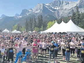 Photo courtesy of Rocky Mountain Soap Co.
Rocky Mountain Soap Company Women's Run & Walk participants get in a little pre-race stretching during the annual weekend event at the Canmore Nordic Centre. Photo courtesy of the RMSC.