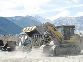 A primary tracked loader moves a load on the main working face at Francis Cooke Regional Landfill on Thursday.