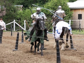 T.J. Duquette, left, of Hamilton, breaks his lance against Colin Miller, of Tucson, Ariz., during the Knights of Valour jousting event at TJ Stables in June 2016. (File photo/Postmedia Network)