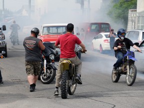 Friends of Kirk Thurston Jr., the victim of the May 18 murder in Timmins, gathered on Aura Lake Street Wednesday to remember him and do some burnouts in his honour, since Thurston was known as an avid dirt biker and trail rider. Part of the celebration included pickup trucks and dirt bikes doing burnouts on the pavement in the neighbourhood where Thurston used to hang out. LEN GILLIS / Postmedia Network