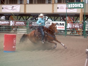 GORDON ANDERSON/DAILY HERALD-TRIBUNE
Ashley Lacey of Sexsmith turns the corner with Hortons Big Deal during the Ladies Barrel Racing during the Slack Rodeo portion of the Grande Prairie Stompede on Wednesday afternoon at Evergreen Park. Lacey finished nearly a second behind Carman Pozzobon of Aldergrove, B.C., clocking in a time of 17.417.  Pozzobon finished first in a time of 16.607.