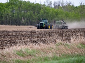 Randy Vanderveen/Special to the Herald-Tribune 
Dust rises as a farmer seeds a field in the Buffalo Creek area between Highway 59 and the Emerson Trail recently. Most area farmers are close to finishing their seeding after a late spring.