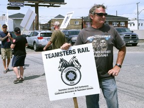 hn Lappa/Sudbury Star/Postmedia Network

Mike Plue, of Division 308 of Teamsters Canada Rail Conference, pickets alongside other members at the CP Sudbury yard in Sudbury on Wednesday. Roughly 30 workers in Sudbury, and about 250 in Northern Ontario were affected by the strike. The train operators voted 94 per cent in favour of strike action to back their contract demands in early April and voted 98 per cent to reject CP's final offer last Friday. However, a few hours after the strike began, Canadian Pacific Railway Ltd. reached a tentative pact with the Teamsters. Operations will resume Thursday at 6 a.m. local time across Canada, the Teamsters Canada Rail Conference said in an emailed statement. The agreement covers about 3,000 conductors and locomotive engineers, the union said.