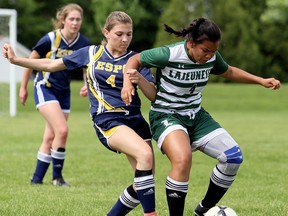 Pain Court Patriotes' Courtney Legere, left, tangles with Windsor Lajeunesse's Maya Calongcagong in the first half of the SWOSSAA 'A' senior girls' soccer final at the Keil Drive soccer complex in Chatham, Ont., on Wednesday, May 31, 2018. (Mark Malone/Chatham Daily News)