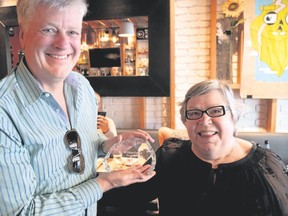 Harvey Locke receives the Wilburforce Foundation's conservation leadership award from Rose Letwin, founder and president of Wilburforce Foundation.Photo courtesy of Pat Morrow.