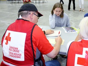 Canadian Red Cross volunteer Jeff Foster takes down Jayden Payne’s information during an emergency training exercise at the Pyramid Recreation Centre on Thursday, May 31, 2018 in St. Marys, Ont. (Terry Bridge/Stratford Beacon Herald)