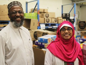 Imam Michael Taylor (on left) and Mona Rahman, co-chairs of the Give 30 Team Kingston campaign, at the Partners in Mission Food Bank in Kingston, Ont. on Tuesday May 29, 2018. Proceeds of the campaign go straight to the foodbank. Steph Crosier/The Whig-Standard
