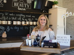 Corrie Gallant, owner of Beauty Barn Spa, poses with her safe makeup products. (ALEX VIALETTE/THE EXPOSITOR)