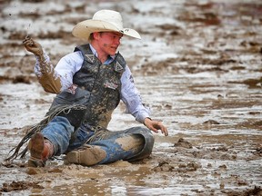 FILE PHOTO
Fox Creek cowboy Hunter Sawley is tossed off a horse named Yellow Coconut during the novice saddle bronc event at last year’s Calgary Stampede.