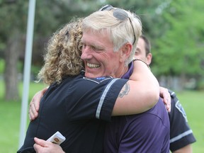 Jim Keech hugs paramedic Alexis Stoller at City Park in Kingston, Ont. on Thursday May 31, 2018. In July 2017 Stoller, along with Eric Donelle and Derek MacGillivray, from Frontenac Paramedic Services, all responded to the west end YMCA where Keech was having a heart attack. Their work and quick thinking saved his life. Steph Crosier/The Whig-Standard