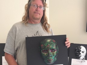 John Somers shows off a mask he made as part of a Unmasking Brain Injury project through the Brain Injury Association of London and Region. (HEATHER RIVERS/SENTINEL-REVIEW)