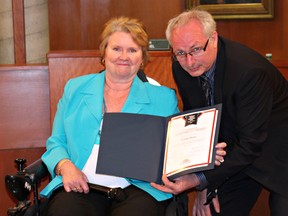Linda Hunt is presented an accessibility award by Coun. Brian Van Tilborg. (Submitted Photo)
