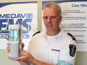 Rodney Hetherington, operations manager, Chatham-Kent Medavie EMS, displays a handheld blood analysis device that members of the community paramedic team will soon be using in the field. (Ellwood Shreve/Postmedia Network)