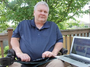 Peter Zein, a member of the city’s accessibility advisory committee, shows on his computer the Stratford Tourism Alliance’s website, which soon will be updated to include more information about local businesses’ accessibility features. (JONATHAN JUHA, Beacon Herald)