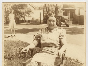 This picture of Delia Gordon sitting on the front lawn of her Bagot Street home is one of 20 photographs that comprise the "Facing the Street: An exhibit by the Swamp Ward & Inner Harbour History Project," which opens this week.