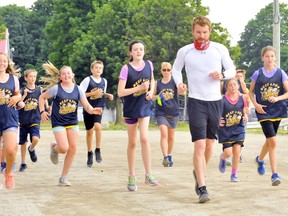 Ultra-marathoner Mike Mathews of Port Dover is in the midst of a challenging 30-hour run at the Norfolk County Fairgrounds in Simcoe. The run is a fundraiser for Make-a-Wish Southwestern Ontario. There to support him Friday were members of the West Lynn Public School running club.
MONTE SONNENBERG / SIMCOE REFORMER