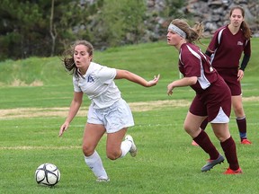 Jordin Rancourt, left, of Marymount Regals, eludes Emma Caruso, of Algonquin, during girls NOSSA soccer semifinal action in Lively, Ont. on Friday June 1, 2018. The Regals won 3-0, but lost to Confederation later in the day. John Lappa/Sudbury Star/Postmedia Network