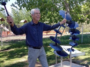 Artist James Cameron with Rotary Park’s newest addition, Disc Drumming.
