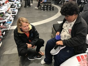 Laura McKenzie Learning Centre student Wyatt, 9, changes the insoles of his new running shoes, Thursday at North Bay's Sport Check.
Jennifer Hamilton-McCharles / The Nugget