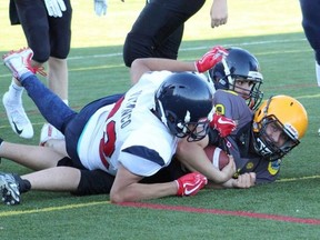 North Bay Jr. Varsity Bulldogs quarterback Jacob Aubertin (8) faced a tough Vaughan Rebels defence in their Ontario Provincial Football League contest in southern Ontario, Saturday. Chris Allard Photo