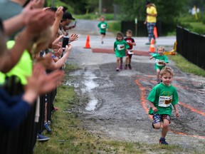 Young athletes race for the finish line while parents cheer them on at the 12th Annual County Kids of Steel Triathlon  on Sunday June 3, 2018 in Picton The first race of the day was the untimed 3-5 year old sub-midget age group.Tim Miller/Belleville Intelligencer/Postmedia Network