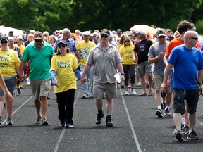 Cancer survivors in yellow shirts lead the first lap around the track at Trenton High School to start off the Quinte West/Brighton Relay for Life on Saturday June 2, 2018 in Quinte West. Tim Miller/Belleville Intelligencer/Postmedia Network