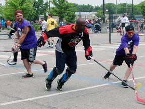 Players get into the action on Saturday at the 12th annual Walter Gretzky Street Hockey Tournament. More than 1,500 players on 135 teams participated in the three-day event, which raises money for the Lung Association. Michelle Ruby/Expositor Staff