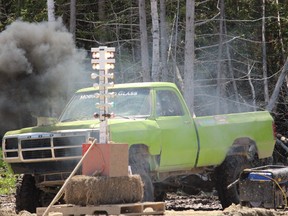 A truck spews diesel smoke at the 2018 Mud Fest on Sunday, June 3.