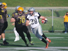 Sudbury Spartans running back Josh Cuomo evades a North Bay Bulldogs tackle during Northern Football Conference action at James Jerome Sports Complex on Saturday. The Spartans won 62-6. (Keith Dempsey/For The Sudbury Star)