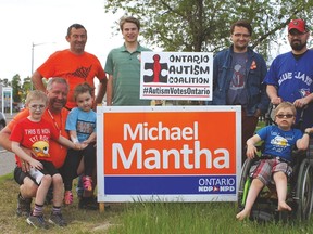 Photo by Dennis Lendrum/For The Mid-North Monitor
Algoma-Manitoulin NDP candidate Michael Mantha and his crew (Ross Johnston, Frederic Diebel, Dennis Lendrum) stopped by the Dixons. Six-year-old Christian told Mantha that the Ontario Autism Coalition sign was his and he was so proud of it. Christian wanted Mantha to sit beside him. Christian’s sister Brookelynn sat on Mike’s knee. After the photo Ricky and Mantha were doing high fives as they had previously met at the local Snow-A-Rama event. Ricky was the 2018 Easter Seals ambassador.