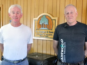 After 65 years in business, R.J. Dungey & Sons Ltd. has closed its doors. Pictured are the co-owners, brothers John (left) and Bill, in their Georgina St., Mitchell office last week. ANDY BADER/MITCHELL ADVOCATE