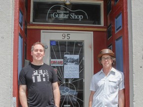 Kingston Guitar Shop co-owners, Brant Hanna and Gord Mylks stand outside their soon to be closed shop on Clarence at Wellington streets in Kingston, Ont. on Wednesday May 30, 2018. Julia McKay/The Whig-Standard