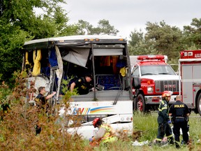 Police and firefighters respond to a serious collision involving a passenger bus west of Prescott on Highway 401 on Monday, June 4, 2018 near Prescott, Ont. (MARSHALL HEALEY/Special to The Recorder and Times)