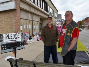 So far, the handful of protesters outside the VLC shelter building have received 25 signatures, each pledging $100 towards their $350,000 goal. Ian MacLellan, left, and Ray Botten, and Wayne Flett, not pictured, have been sleeping outside their former shelter since the shelter residents and VLC staff were evicted last Tuesday. Botten said the protest is about paying off the mortgages owing on the building. The separate GoFundMe page "Save the Sanctuary Shelter" had $2,010 on Monday. (Scott Dunn/The Sun Times)