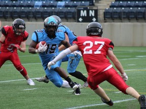 The Fort McMurray Monarchs offense tries to avoid being tackled as they make a play for the end zone in their game against the Alberta Central Buccaneers on June 2, 2018, at Shell Place in Fort McMurray, Alta. Laura Beamish/Fort McMurray Today/ Postmedia Network.