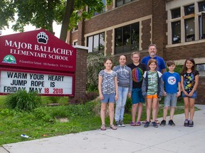 Major Ballachey School teacher Andrew Campbell poses with students Alexis Graham (left), Emily Blasdell, Cynthia Hotton, Kaitlynn McCombie,  Finlay Taves and Tandralynn Martin. Campbell organized a student vote for the upcoming Ontario election, bringing in local local candidates to answer questions from students. (Alex Vialette/The Expositor)