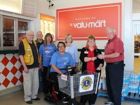 Staff of Dionne's valu-mart and the Lions Club of Cochrane were happy to provide a mobility shopper cart for the grocery store. The apparatus is sure to help those who have difficulty during their shopping expeditions. Available for the presentation were Vince Cloutier, Richard Moore, Jennifer Vojz, Melissa Brunette, Sharon Martin, Lila Paquet and Gerry Robichaud. Times-Post photo by Debbie Morin