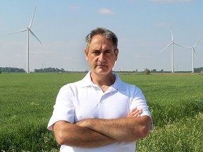 Kevin Jakubec, spokesperson for the citizen group Water Wells First, sees the June 7, 2018 provincial election as a chance for a 'reset' to deal with issues that have plagued renewable energy projects. He is seen here with the North Kent Wind farm project in the background, north of Chatham, which the citizen group has been waging a two-year battle against over water wells it says have gone bad due to vibrations from the construction and operation of the industrial wind turbines. Ellwood Shreve/Postmedia Network