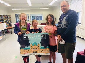 Students at Zorra Highland Park P.S. are urging adults to vote after taking part in a student vote Tuesday. From left Paige Borman, Abby Howe, Bronwyn Turvey and teacher Matthew Roberts. HEATHER RIVERS/SENTINEL-REVIEW