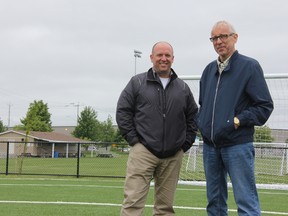 With Stratford Soccer Association’s clubhouse in the background, president Michael Vancea, left, and past-president and now Stratford Coun. Graham Bunting at the Cowan Field at Festival Hydro Community Park. JONATHAN JUHA/THE BEACON HERALD/POSTMEDIA NETWORK