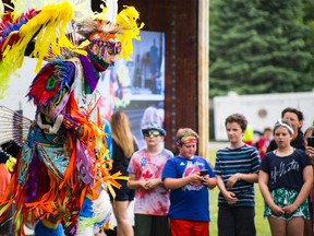 River Christie-White performs a traditional Indigenous dance for students attending a Peace Day event in Paris.  (Alex Vialette/The Expositor)