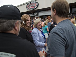 Brantford-Brant NDP candidate Alex Felsky (left) and Ontario NDP Leader Andrea Horwath greet supporters during a return visit on Tuesday to Brantford. (Brian Thompson.The Expositor)