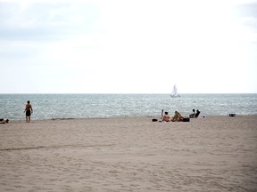 Beach-goers in Port Stanley enjoy a warm start to the month June 1. The Weather Network is predicting plenty of hot days this summer with increased thunderstorms compared to last year. Derek Ruttan/Postmedia News