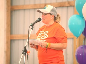 Tracy Rossetti spoke with the crowd of about 500 last Saturday, she is one of the first people to throw the idea a decade ago to launch a ring toss tournament. Since then, the fundraiser has accumulated $500,000, every penny goes towards cancer research and people who have fought or are currently battling cancer.(Shaun Gregory/Huron Expositor)