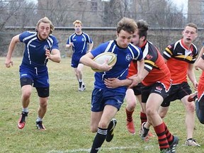 The Quinte Saints (blue uniforms) are the host team for the 2018 OFSAA AA boys rugby championships which kick off Thursday at MAS Park. (Submitted photo)