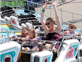 Emickenzie Alliett, 8, left, Trinity Toth, 10, and Megan Franko were enjoying taking a trip on the Polar Express ride at the Kinsmen Fair in Chatham on June 11, 2016. (File photo/Postmedia Network)