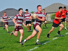 Holy Trinity's Andrew Lance carries the ball during the NSSAA boys rugby final last month. The Titans will compete at the OFSAA Boys A/AA Rugby tournament later this week in Belleville.
JACOB ROBINSON/Simcoe Reformer