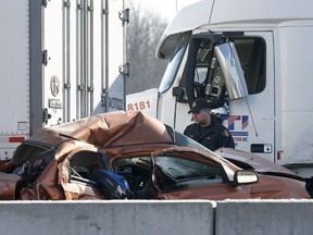OPP investigate an accident on Highway 401 just east of Prescott Ontario Tuesday Nov 28, 2017. A Quebec trucker was arrested early Tuesday morning hours after two people were killed in a five-vehicle crash late Monday on Highway 401. Four people were also taken to hospital after the crash at about 10:30 p.m. Monday between Prescott and Highway 416, one of them by air ambulance with life-threatening injuries. Tony Caldwell Ottawa Citizen